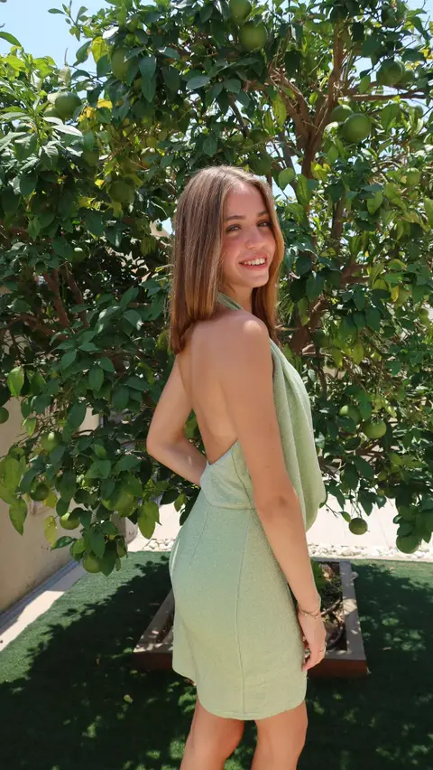 Woman laughing in a beautiful dress at an outdoor party